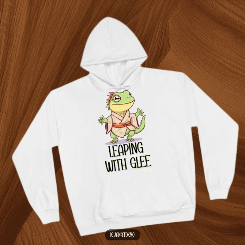 Funny hoodie depicting an iguana character in a kimono, joyfully performing a happy little hop, designed for comfort.