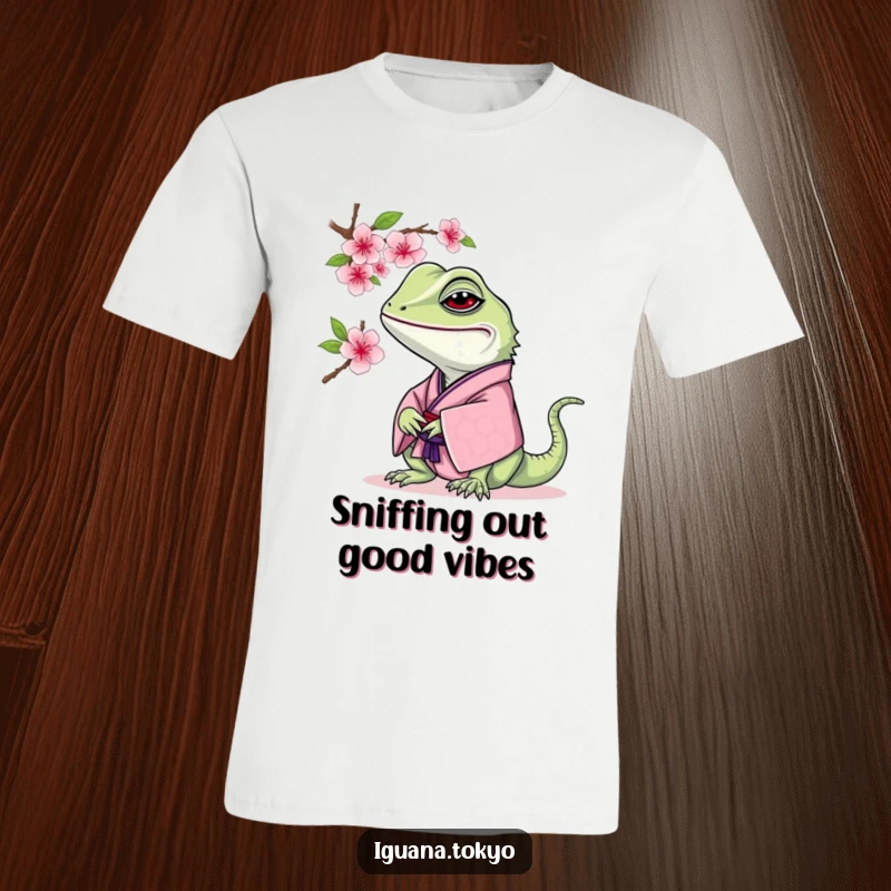 Funny Iguana T-Shirt: Iguana in a traditional kimono curiously smelling a cherry blossom, capturing a serene moment.