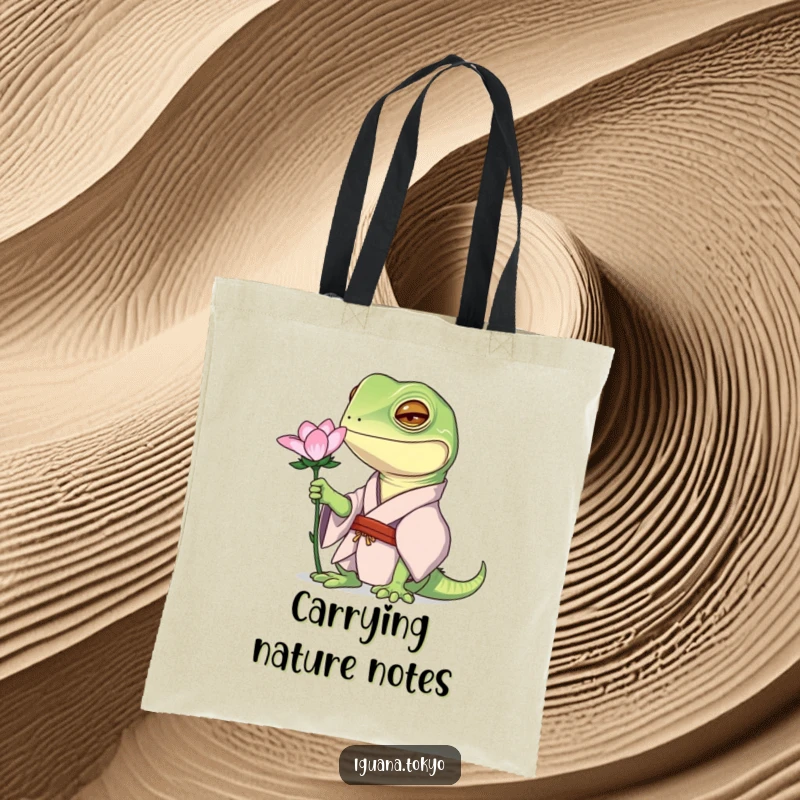 Funny tote bag featuring an iguana character in a kimono, curiously examining a flower, great for nature walks.